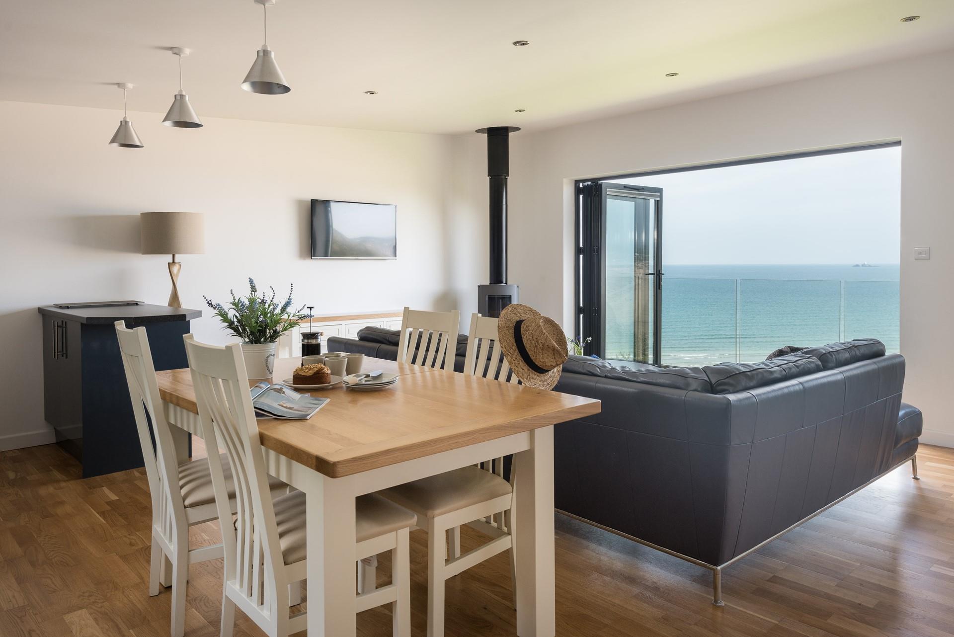 Enjoy a spot of lunch while making the most of the views in this superbly furnished living space. 