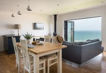 Enjoy a spot of lunch while making the most of the views in this superbly furnished living space. 