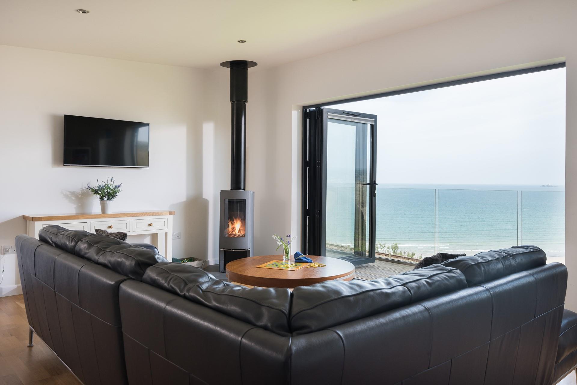 Open the bi-fold doors, gather around the woodburner and listen to the sounds of the sea outside. 