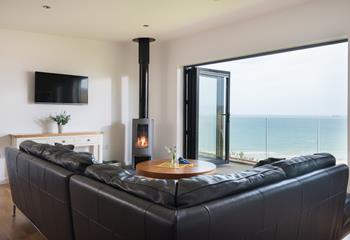 Open the bi-fold doors, gather around the woodburner and listen to the sounds of the sea outside. 