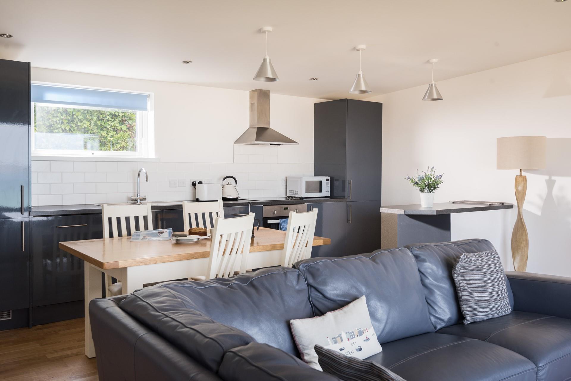 With a well-designed open plan kitchen, you can pop the kettle on and admire the views while you wait for it to boil. 