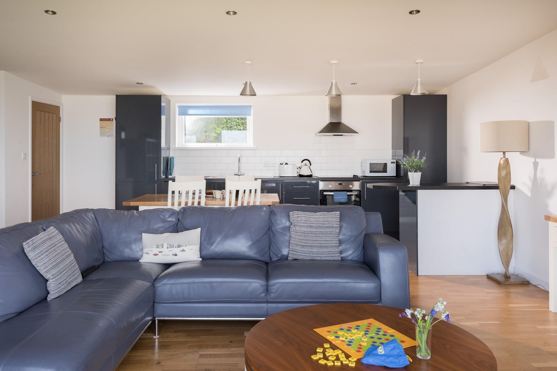 The open plan living area is the perfect space for everyone to gather and enjoy family time together.