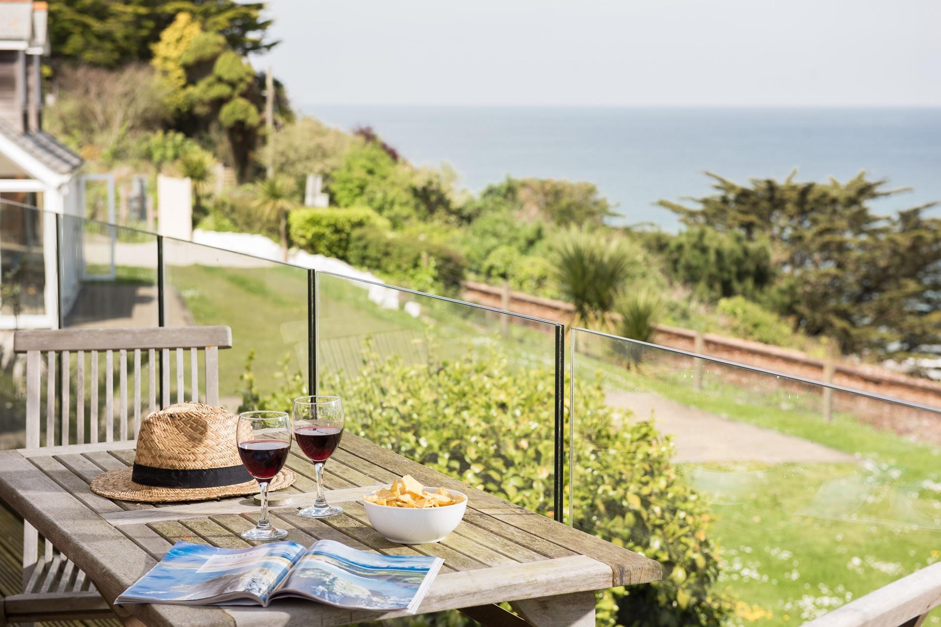 Enjoy dining al fresco on the decked balcony, immersing yourself in the luxurious coastal lifestyle. 