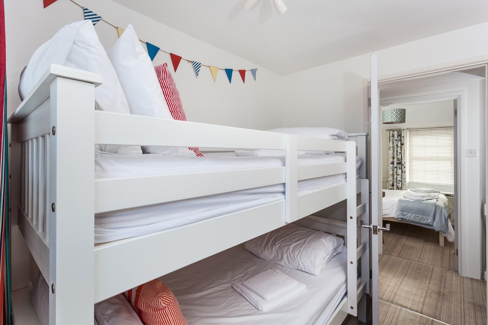 The bunk beds in bedroom 2 are sure to delight children!