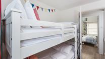The bunk beds in bedroom 2 are sure to delight children!