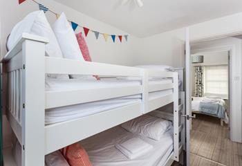 The bunk beds in bedroom 2 are sure to delight children!