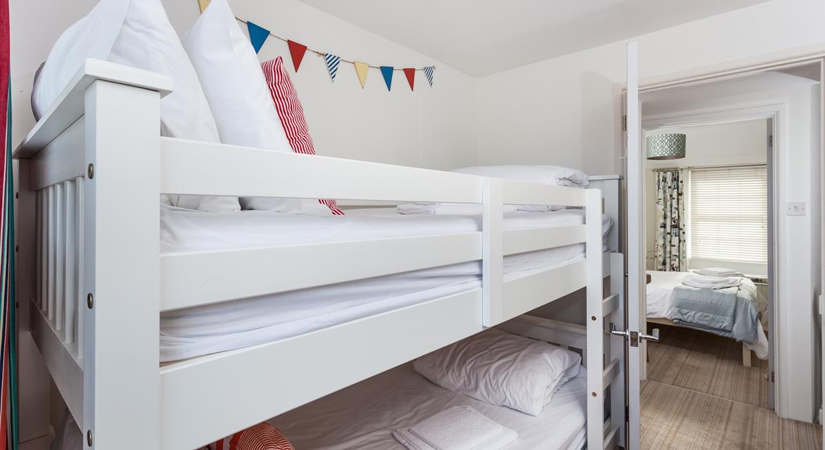 The bunk beds in bedroom 2 are sure to delight children!