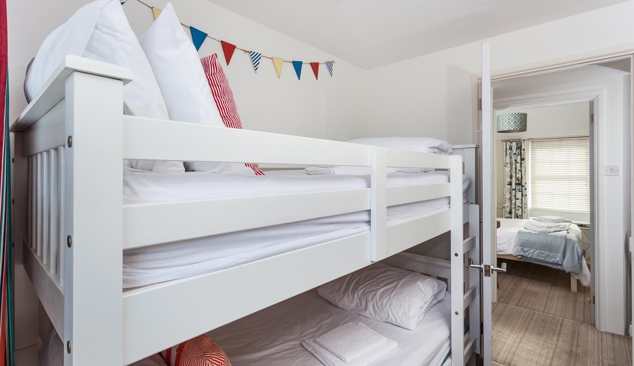 The bunk beds in bedroom 2 are sure to delight children!
