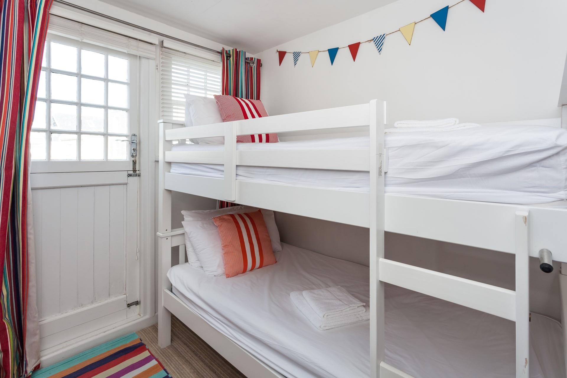 Tuck the kids into the bunk beds after a memorable beach day.