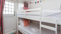 Tuck the kids into the bunk beds after a memorable beach day.