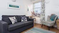 A charming retreat, Bakehouse Cottage seamlessly blends traditional features with modern comfort.
