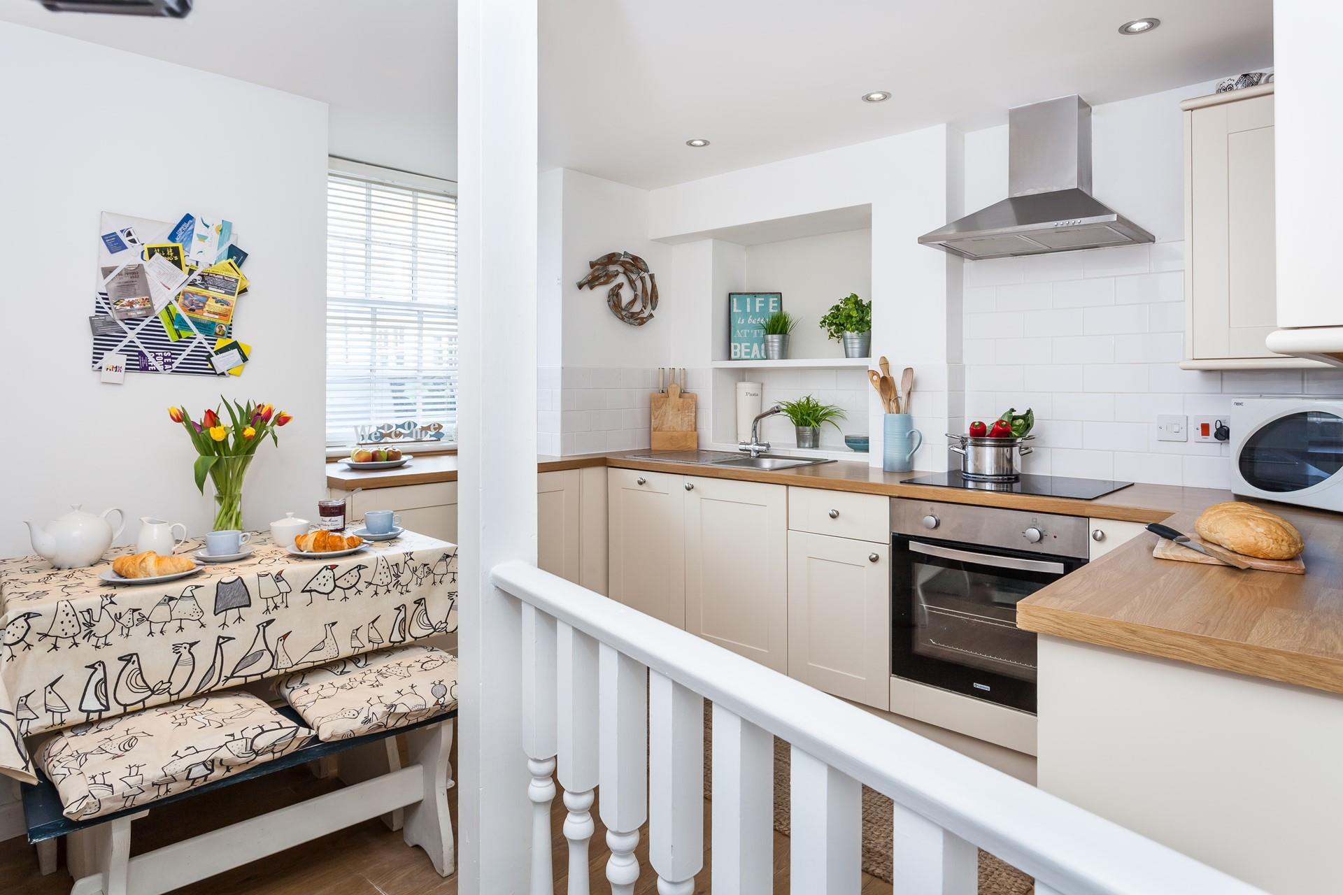 The modern kitchen is well-equipped with modern appliances.