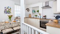 The modern kitchen is well-equipped with modern appliances.