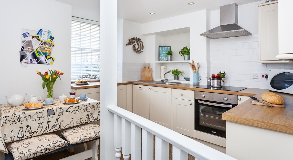 The modern kitchen is well-equipped with modern appliances.