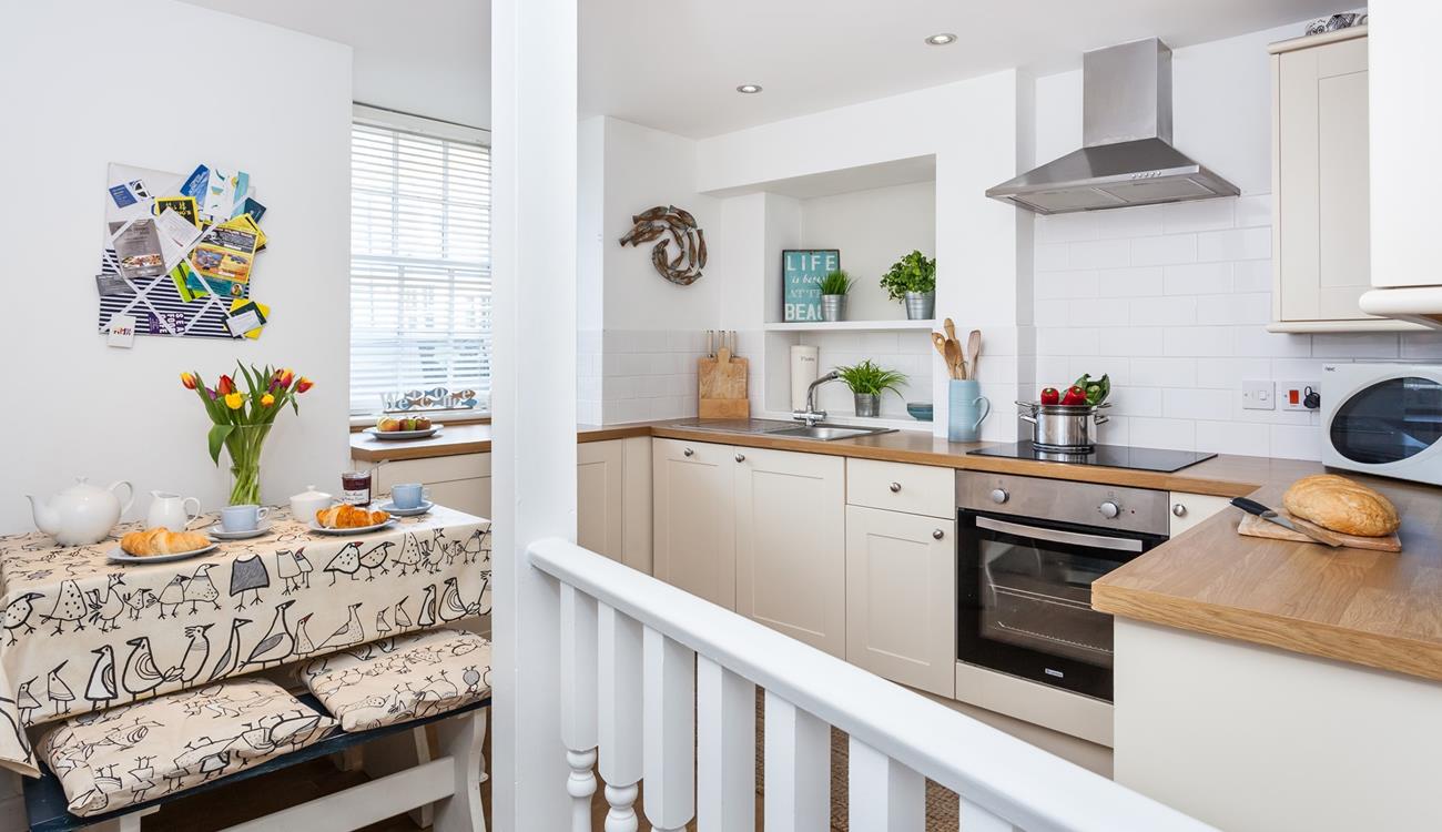 The modern kitchen is well-equipped with modern appliances.