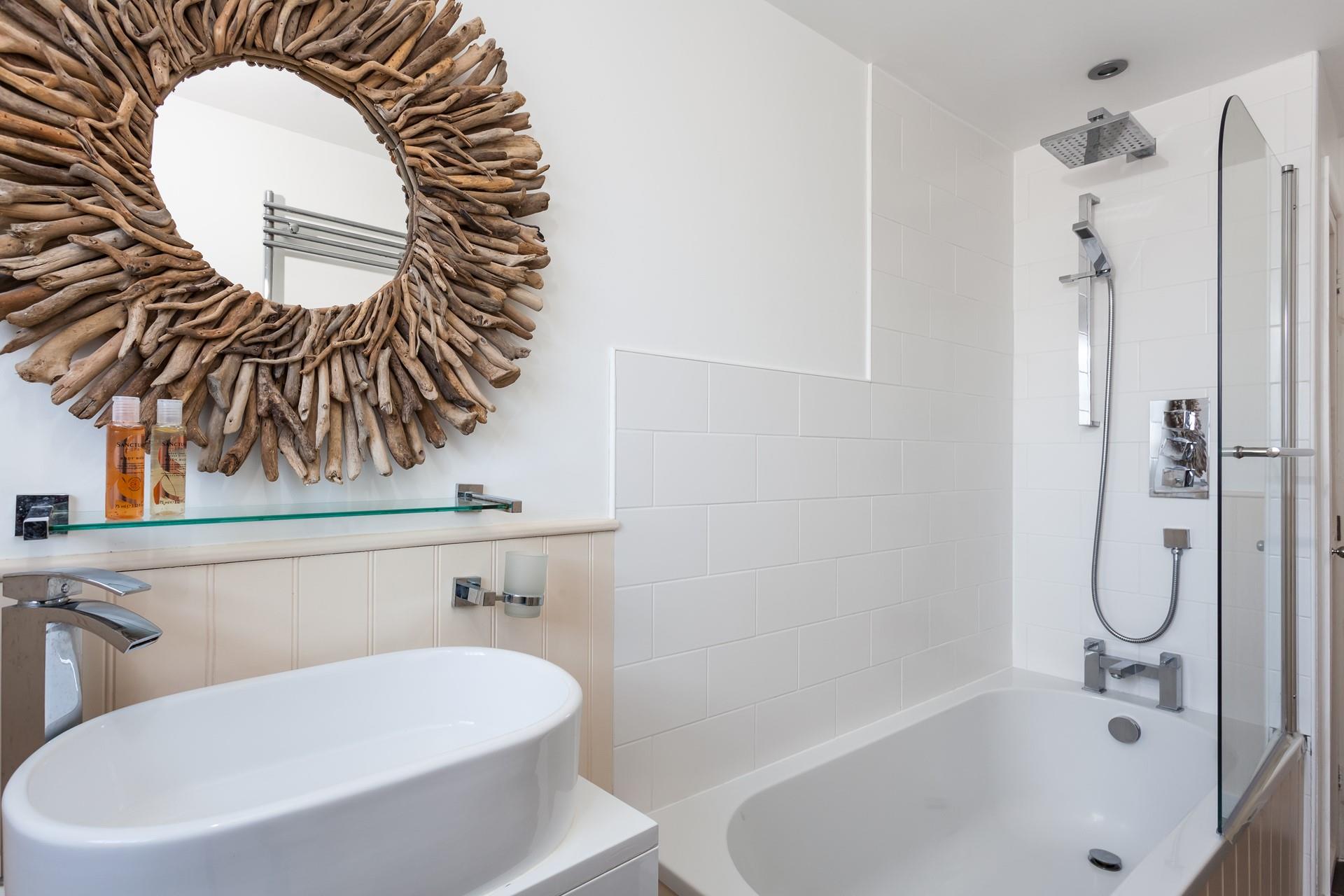 The unique driftwood mirror reminds you just how close to the sea you are.