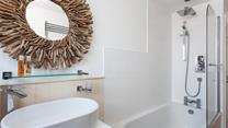 The unique driftwood mirror reminds you just how close to the sea you are.