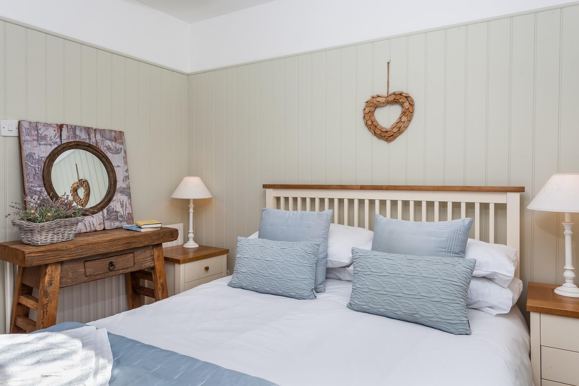 Bedroom 1 has a charming fairytale feel with thoughtfully selected decor to create a homely atmosphere.