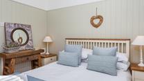 Bedroom 1 has a charming fairytale feel with thoughtfully selected decor to create a homely atmosphere.