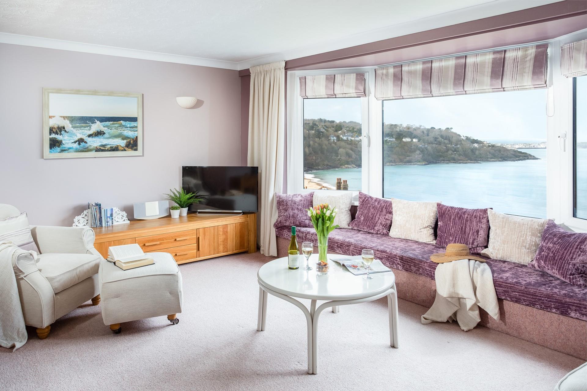 The bay window allows an abundance of light to fill the spacious and cosy living room. 