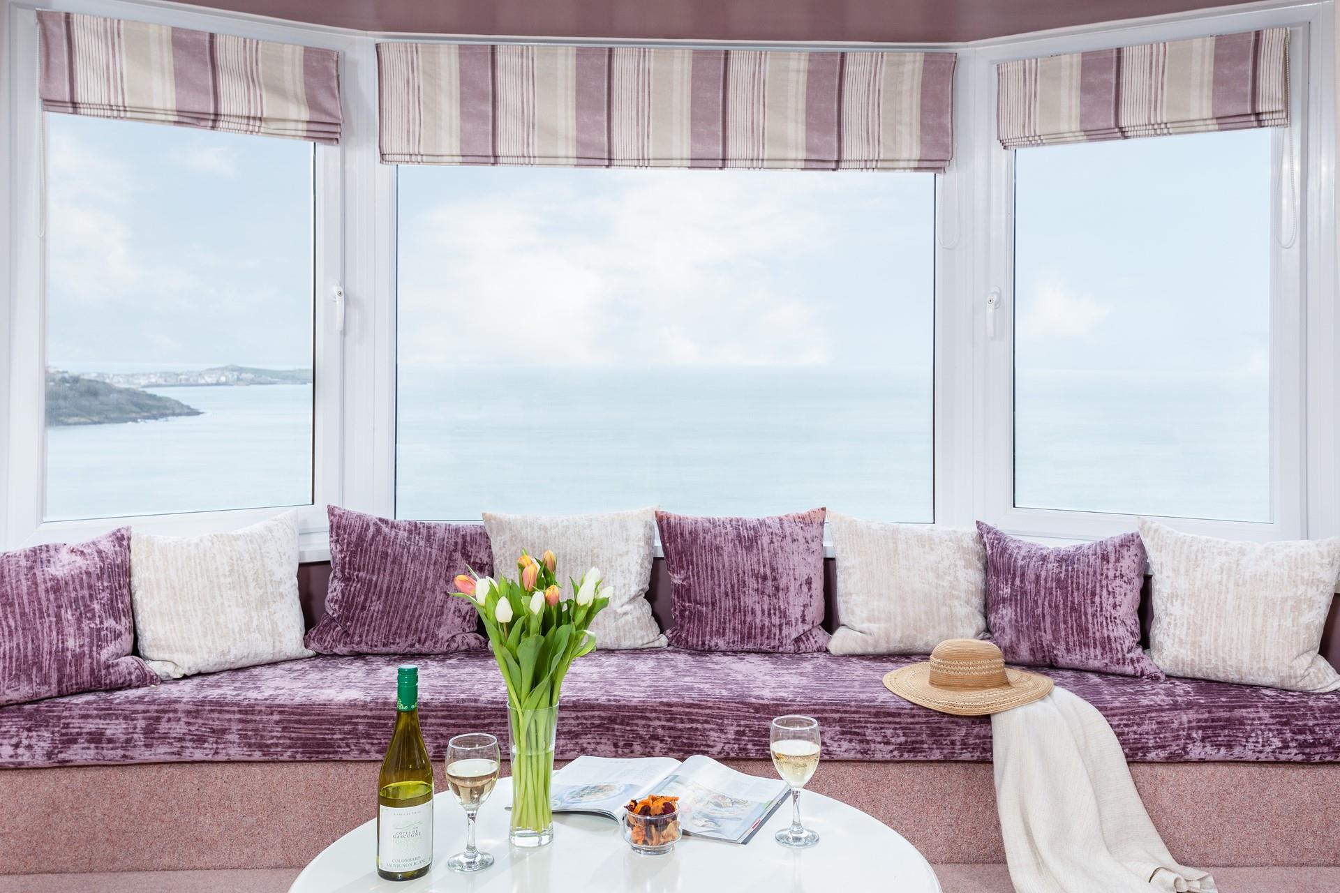 Relax in the window seat and while away the days watching the waves.