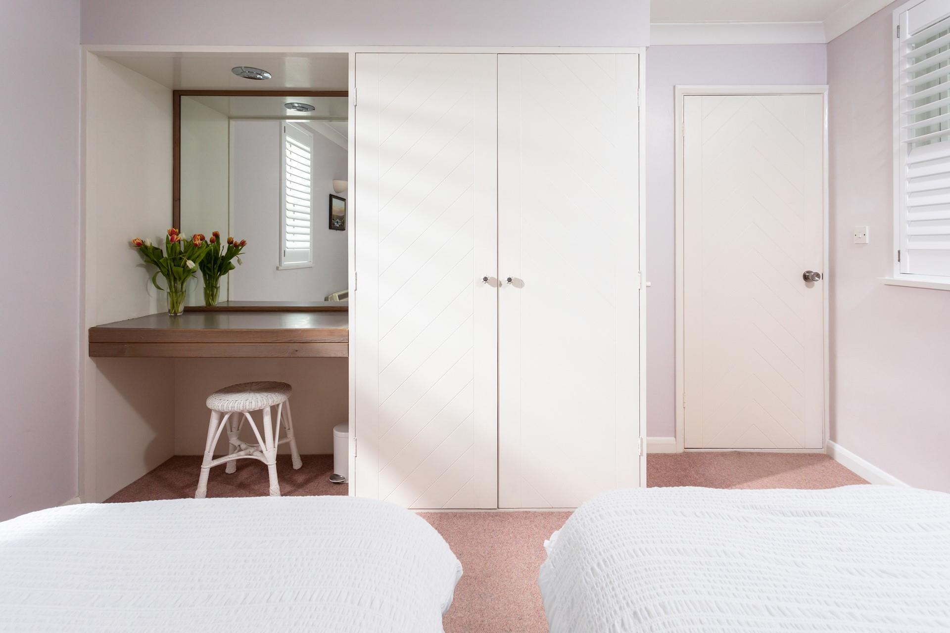 The fitted wardrobe provides ample storage for all your holiday goods. 