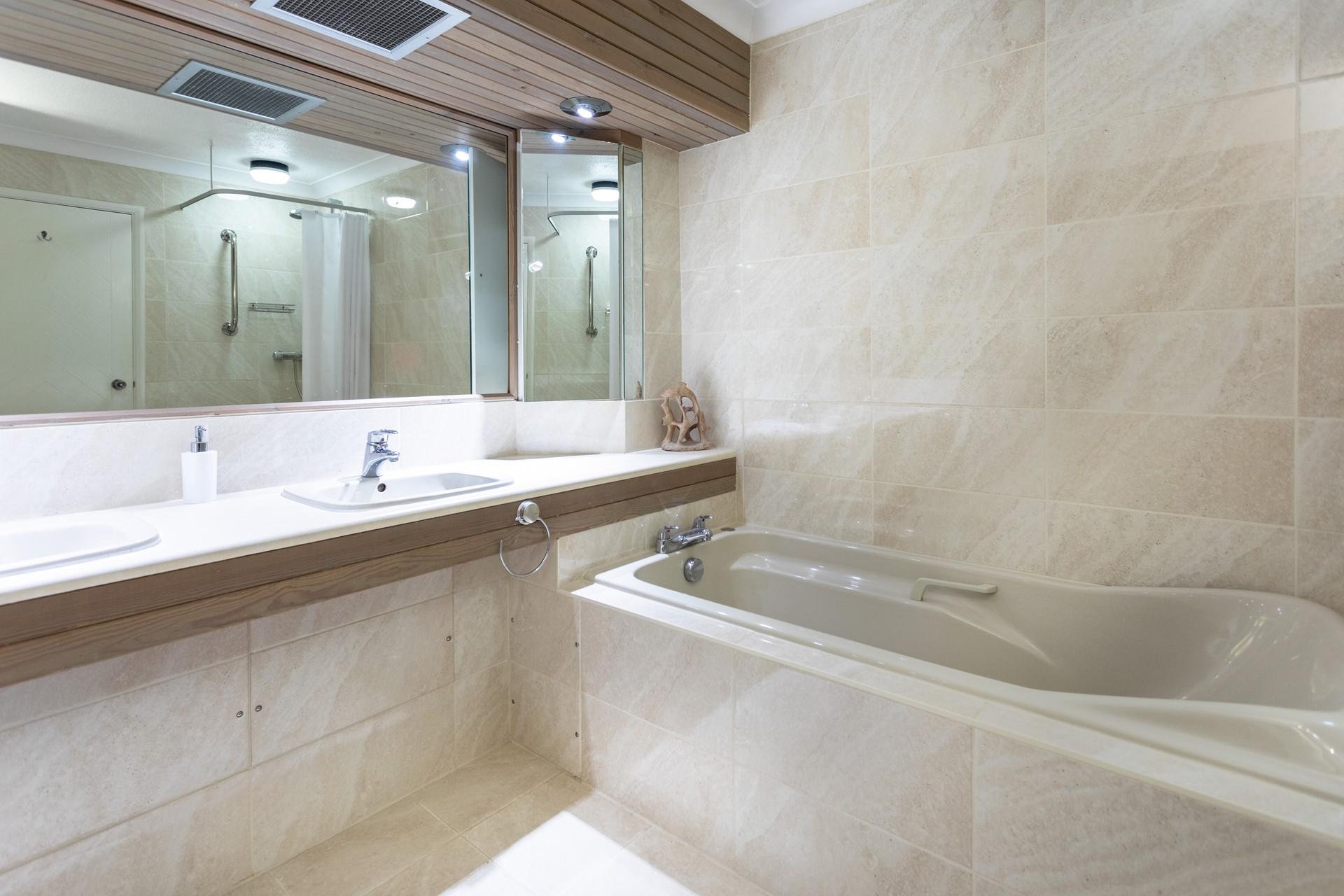 Sink into the large bathtub and leave the stresses of daily life behind. 