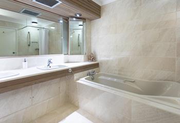 Sink into the large bathtub and leave the stresses of daily life behind. 