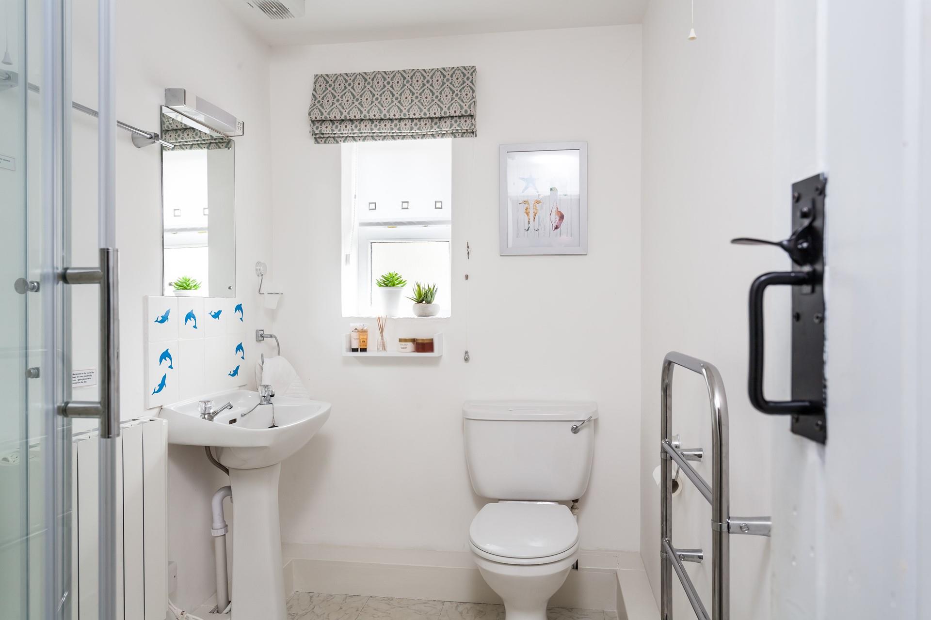 Wash off sandy toes in the shower after a day at Perranuthnoe Beach.