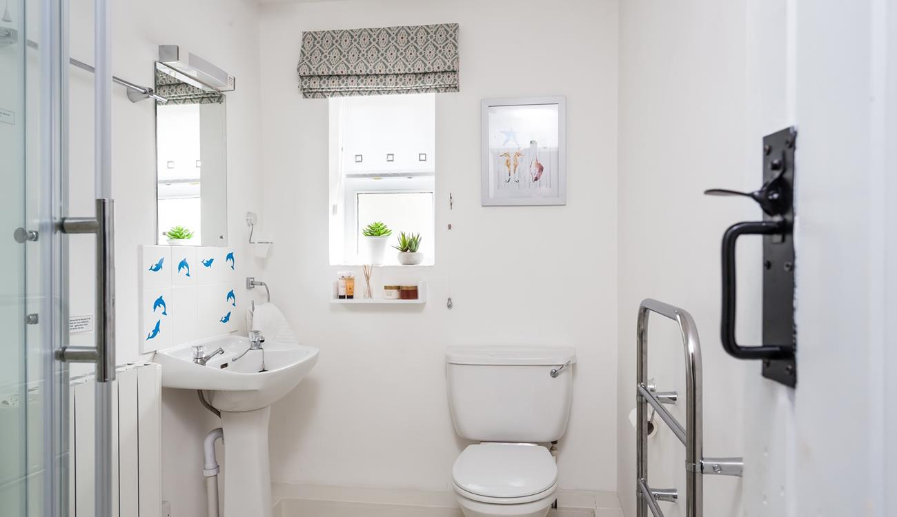 Wash off sandy toes in the shower after a day at Perranuthnoe Beach.