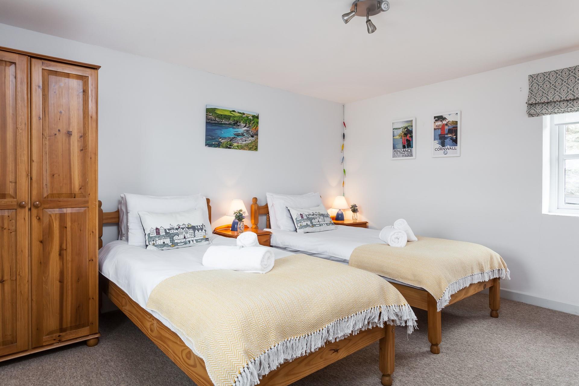 Tuck the kids into bed in the twin room after a memorable day on the beach.