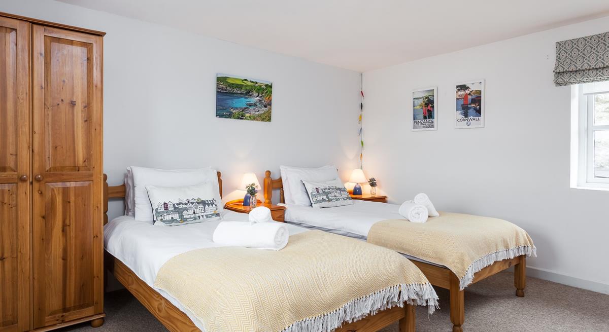 Tuck the kids into bed in the twin room after a memorable day on the beach.