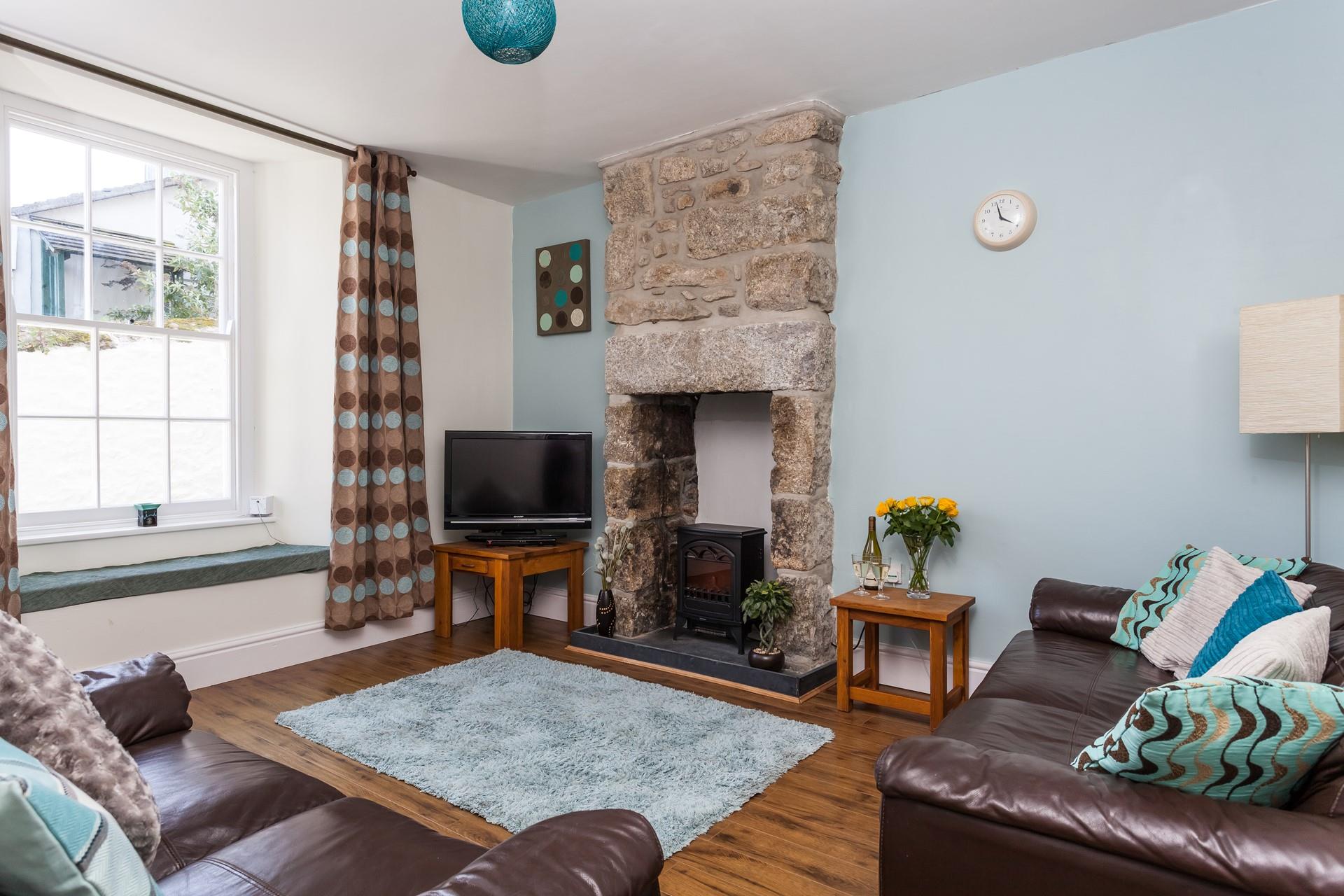 Enjoy cosy evenings curled up next to the wood burner at Vine Cottage.