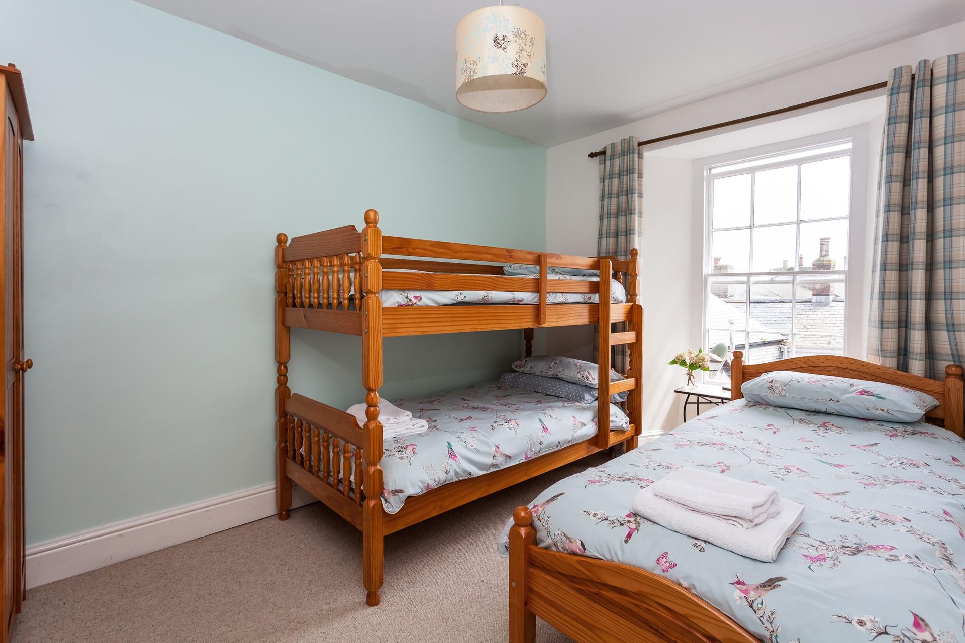 Kids will love a holiday sleepover in the triple bedroom.