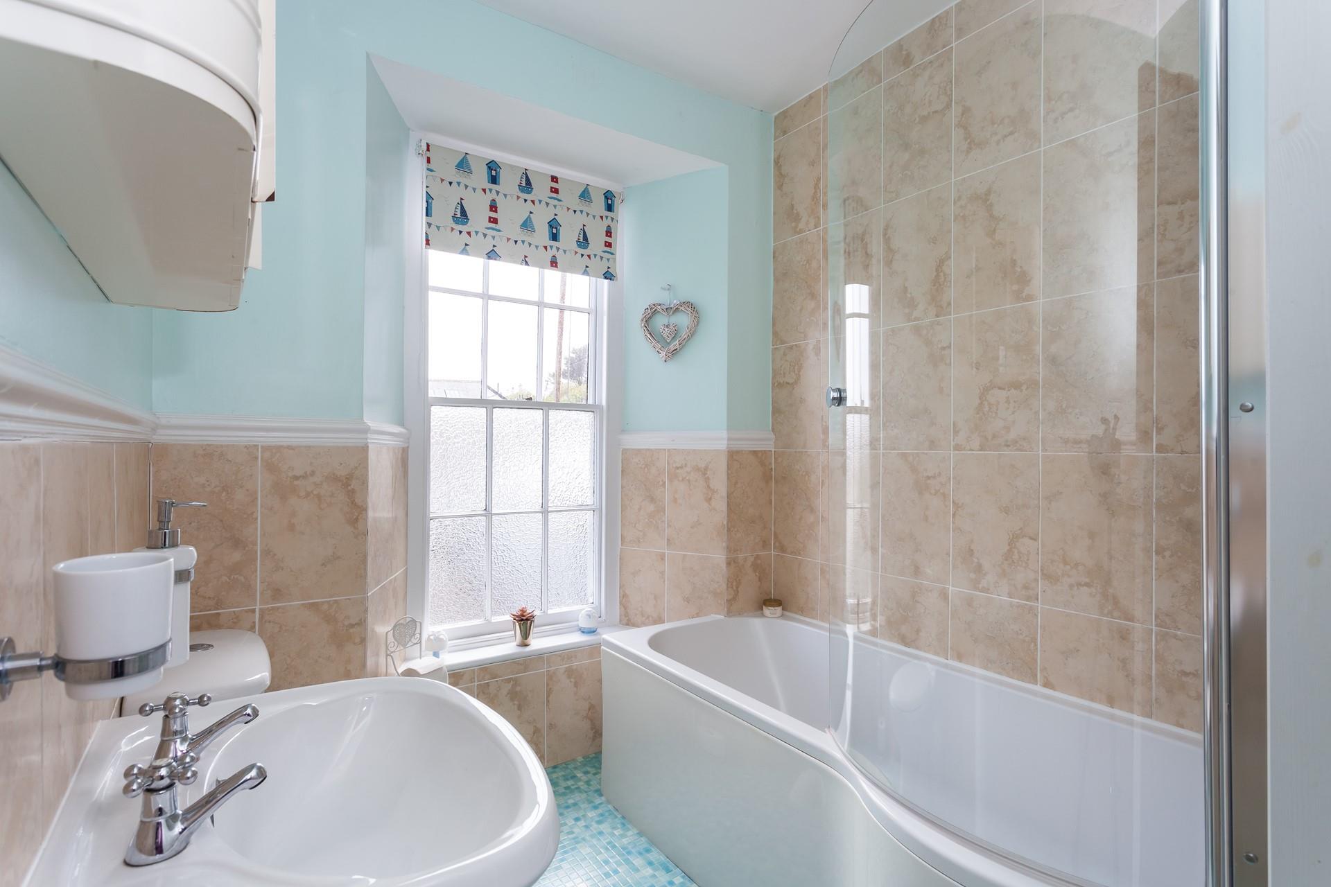The bright family bathroom.