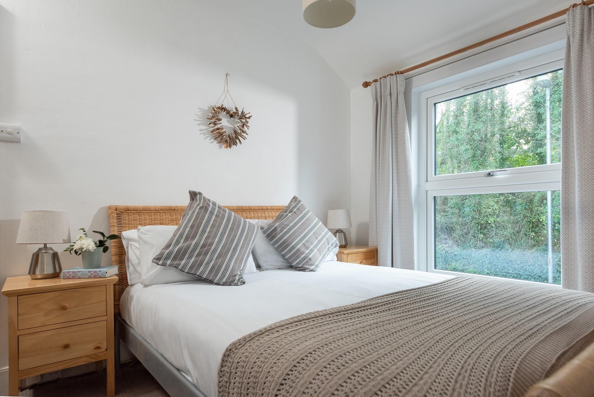 Bedroom 2 also has a calming colour scheme and offers a relaxing night's sleep.