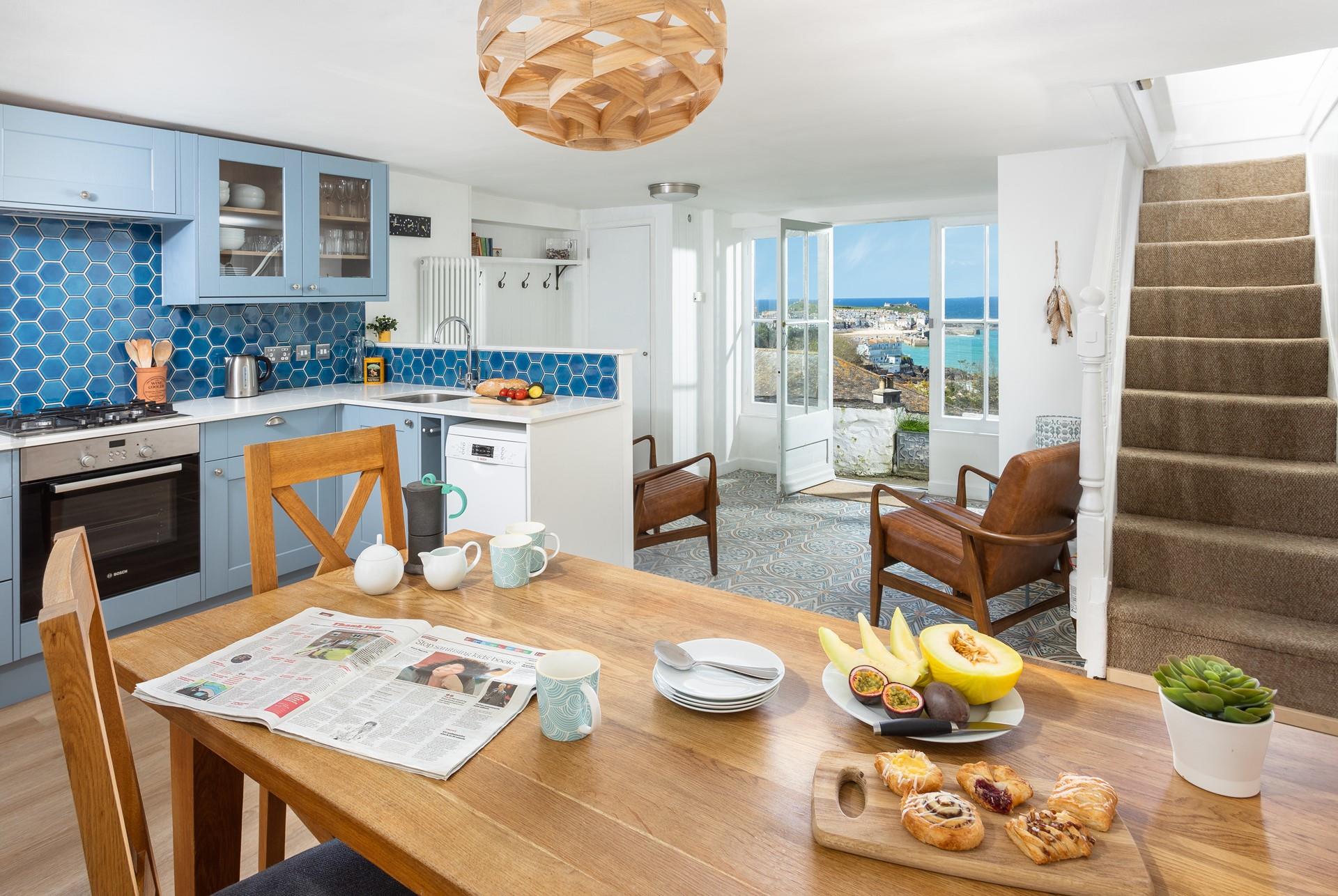 The kitchen and dining area are spacious and light, with a contemporary kitchen and a fabulous view!