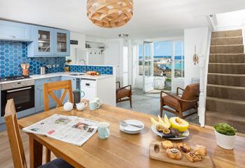 The kitchen and dining area are spacious and light, with a contemporary kitchen and a fabulous view!