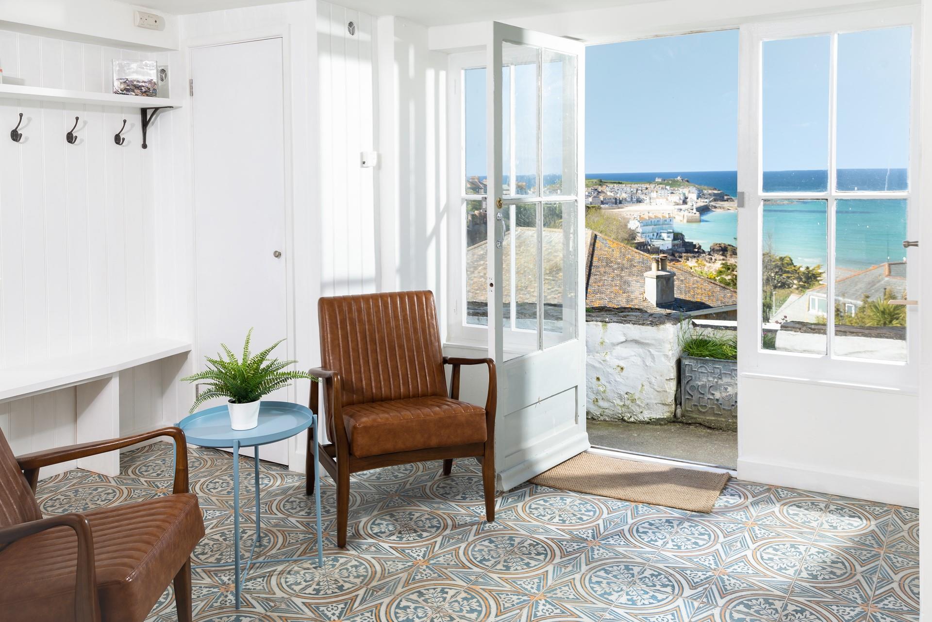 Let the sunshine in and sit and gaze out at the beautiful far-reaching sea views.