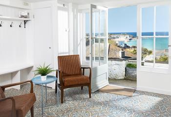 Let the sunshine in and sit and gaze out at the beautiful far-reaching sea views.