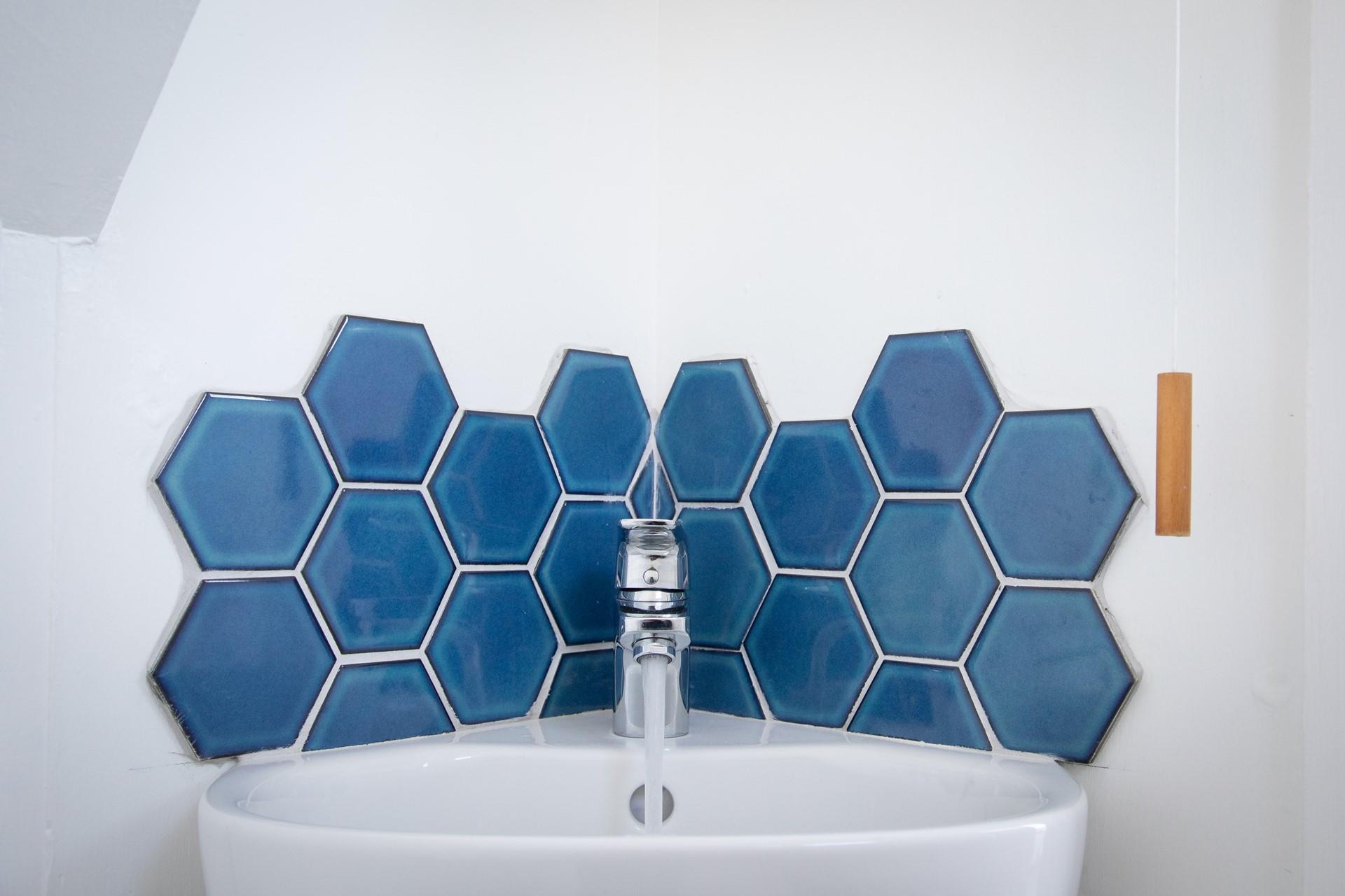 The downstairs cloakroom has a basin and WC and perfectly caters for all six guests.