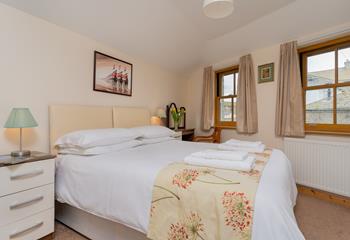 The master bedroom has a king size bed which can be converted into two singles on request.