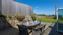 Enjoy a lazy morning breakfast at the outside table, in the peace and quiet of your private garden. 