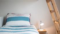 Children will love this cosy bed with ladder leading up to the top bunk. 