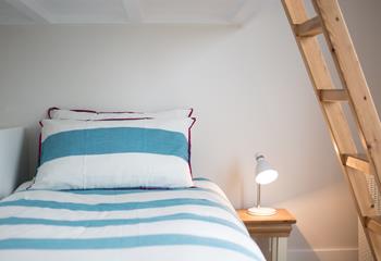 Children will love this cosy bed with ladder leading up to the top bunk. 