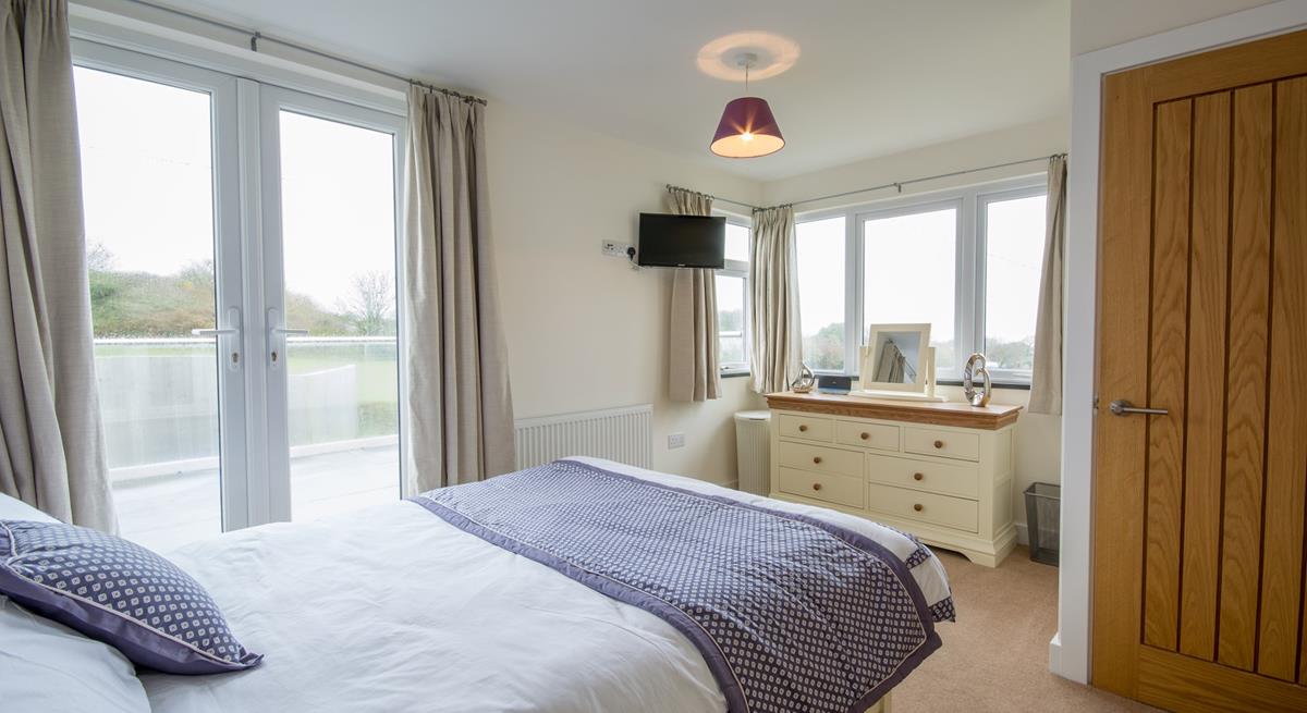 Light and spacious, bedroom 1 benefits from dual-aspect windows allowing plenty of natural light to stream in. 