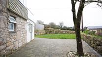 The main entrance is to the side of the property.