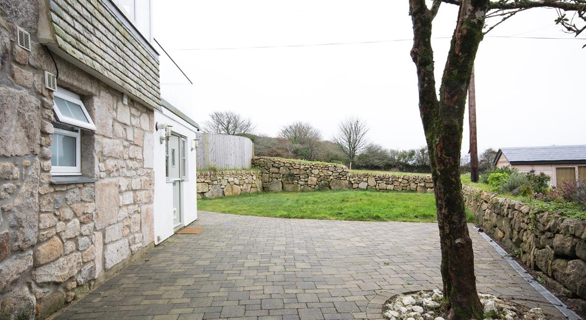 The main entrance is to the side of the property.