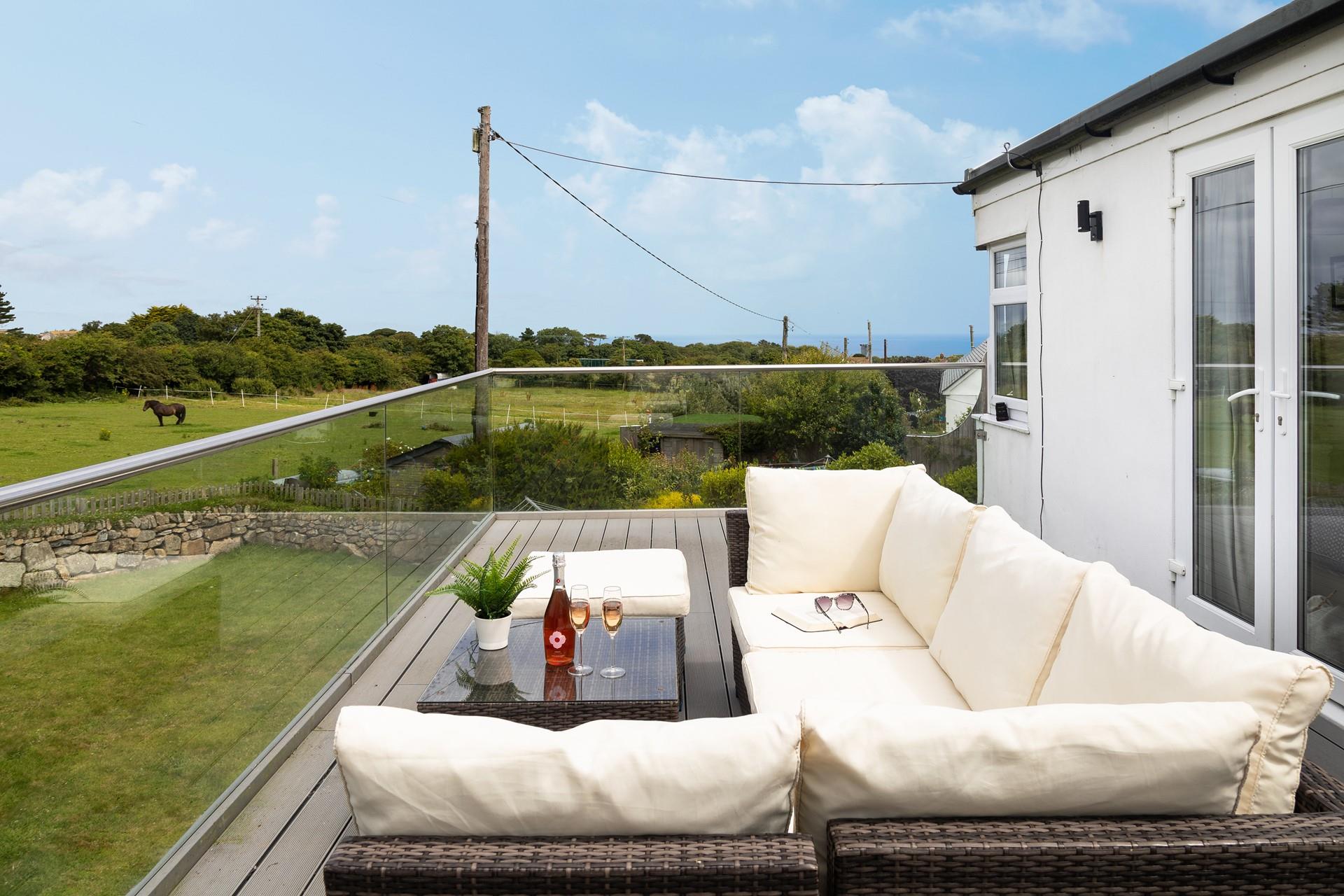 Spend time sharing holiday stories while enjoying the Cornish countryside from your secluded balcony. 