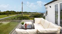 Spend time sharing holiday stories while enjoying the Cornish countryside from your secluded balcony. 